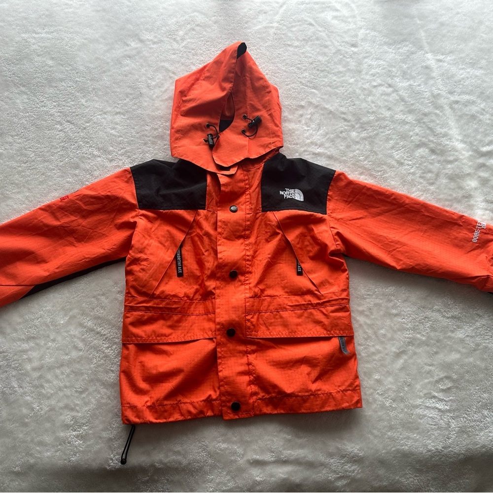 The North Face Gore-TEX Kids Vibrant Orange and Black Raincoat